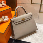 HM KELLY 25CM GRAUES EPSOM-LEDER GOLDENE BESCHLÄGE