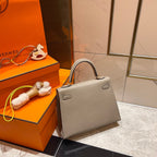 HM KELLY 25CM GRAUES EPSOM-LEDER GOLDENE BESCHLÄGE