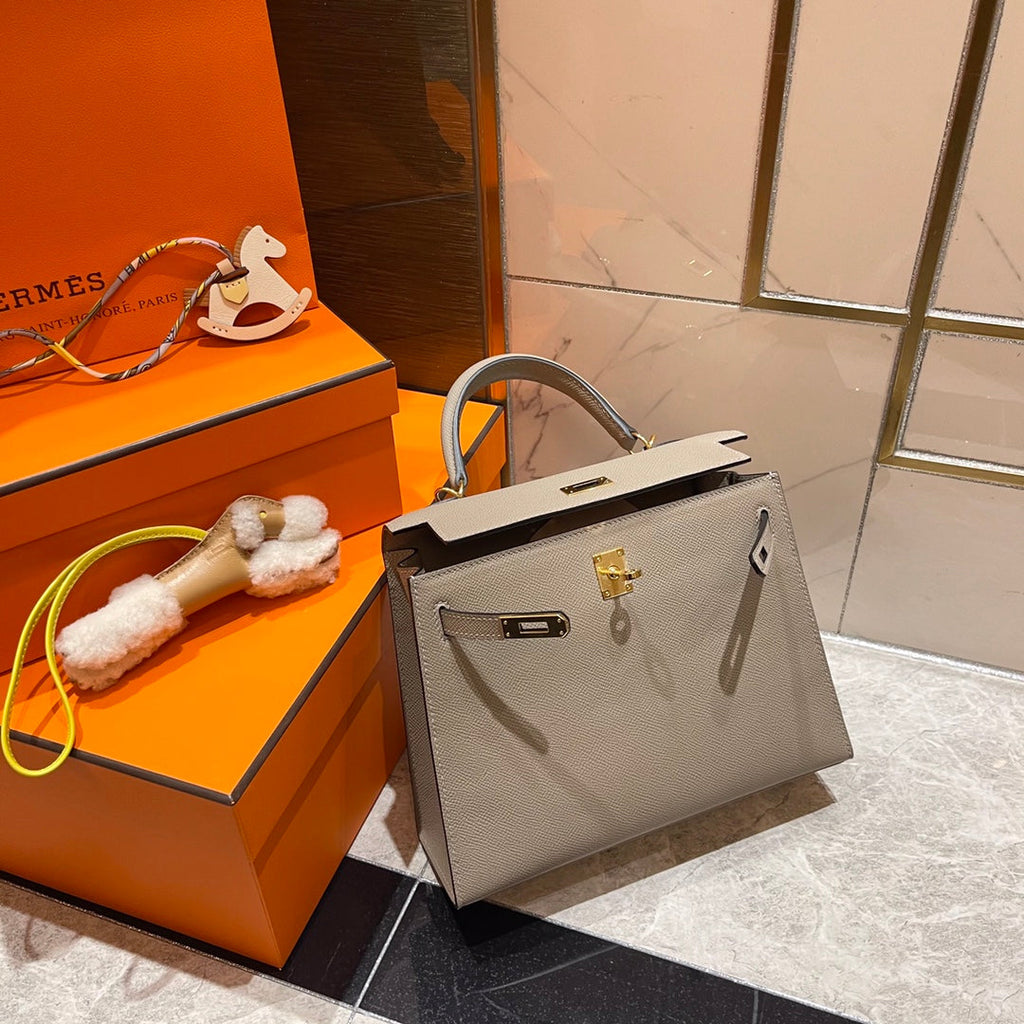 HM KELLY 25CM GRAUES EPSOM-LEDER GOLDENE BESCHLÄGE