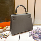 HM KELLY 25CM GRIS MOUETTE EPSOM LEDER GOLDENE BESCHLÄGE