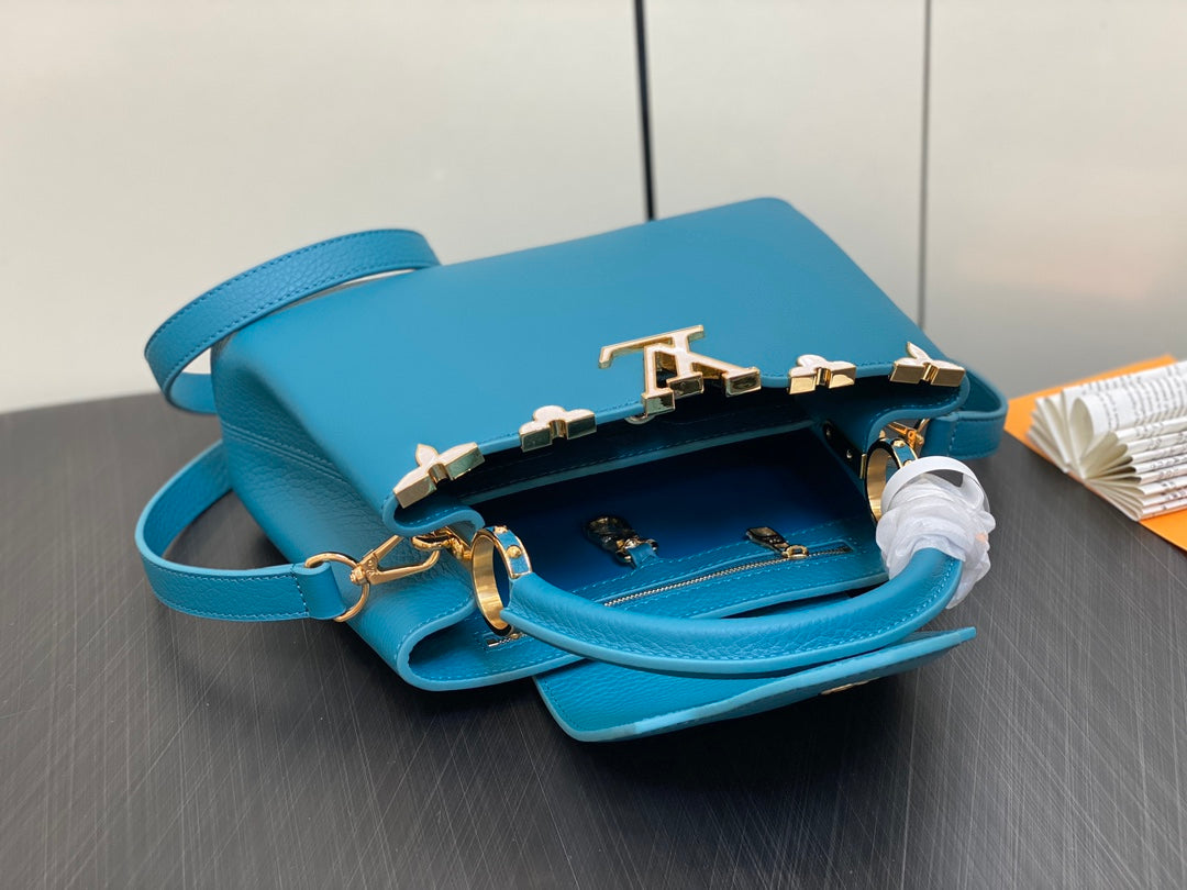 CAPUCINES BB 27 BLUE TAURILLON GOLD HARDWARE