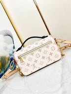 POCHETTE METIS 21.5 WEISS BRAUN MONOGRAMM-LEINWAND 