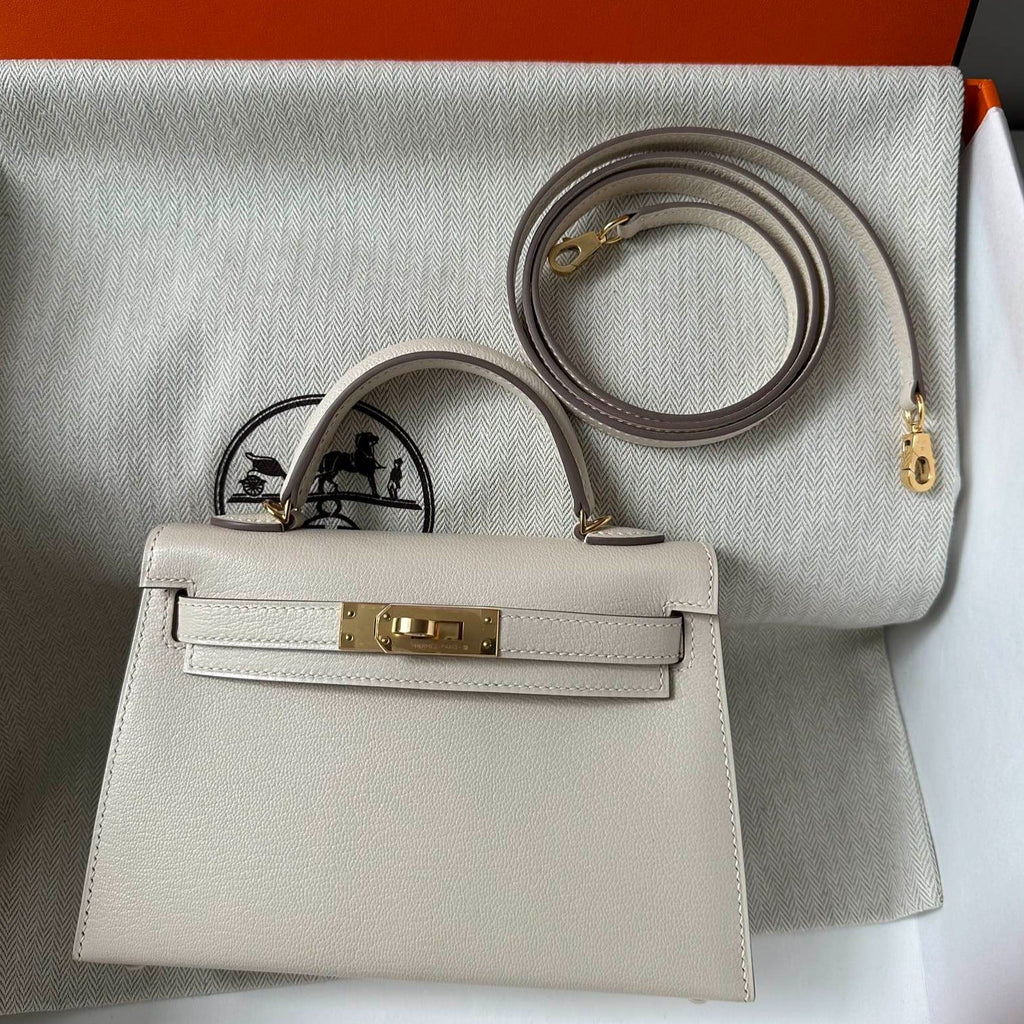 HM KELLY MINI 20 WEISS CHEVRE GOLDENE HARDWARE