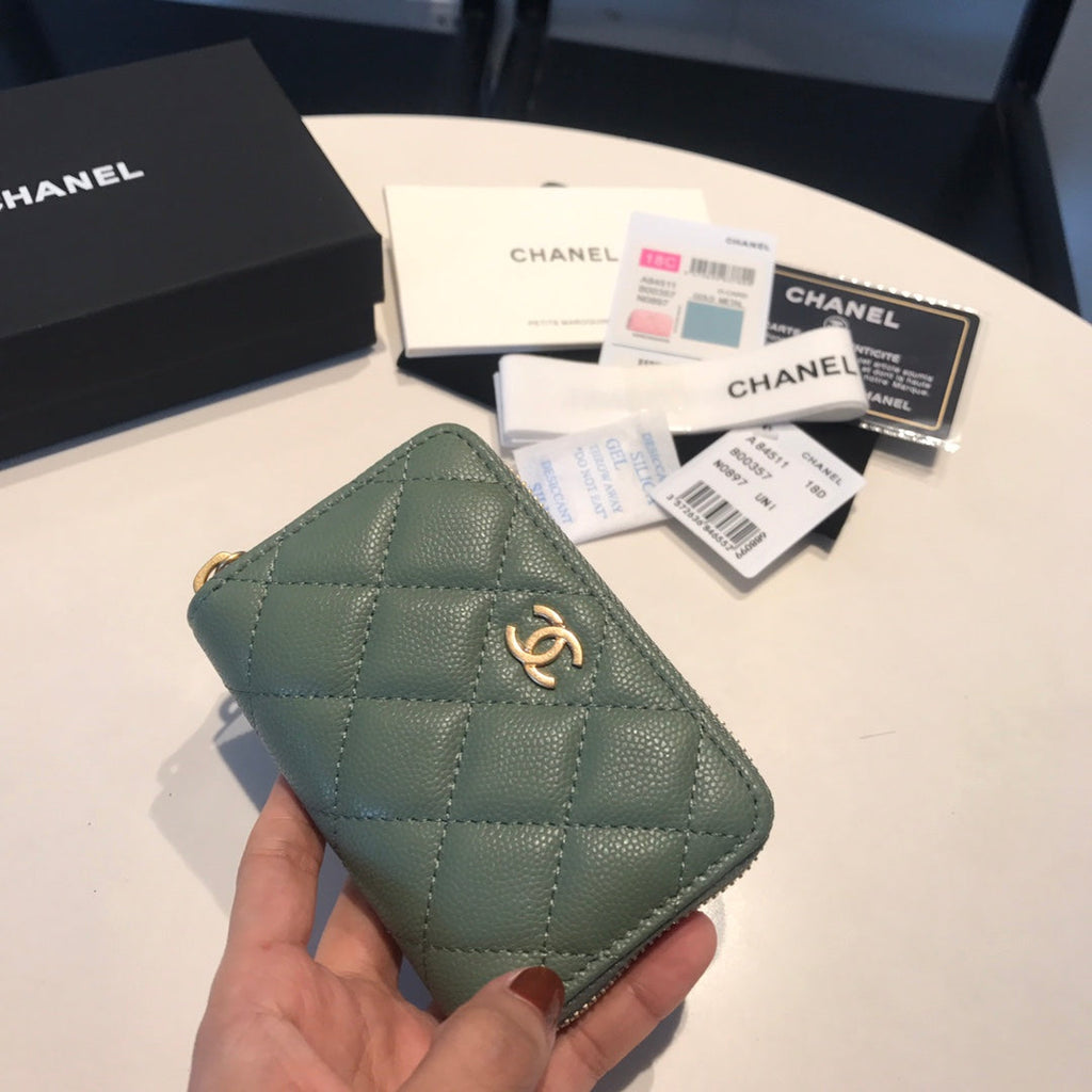 CC Reißverschluss-Kaviar-Geldbörse 11 Türkisfarbenes Kalbsleder Gold Icon