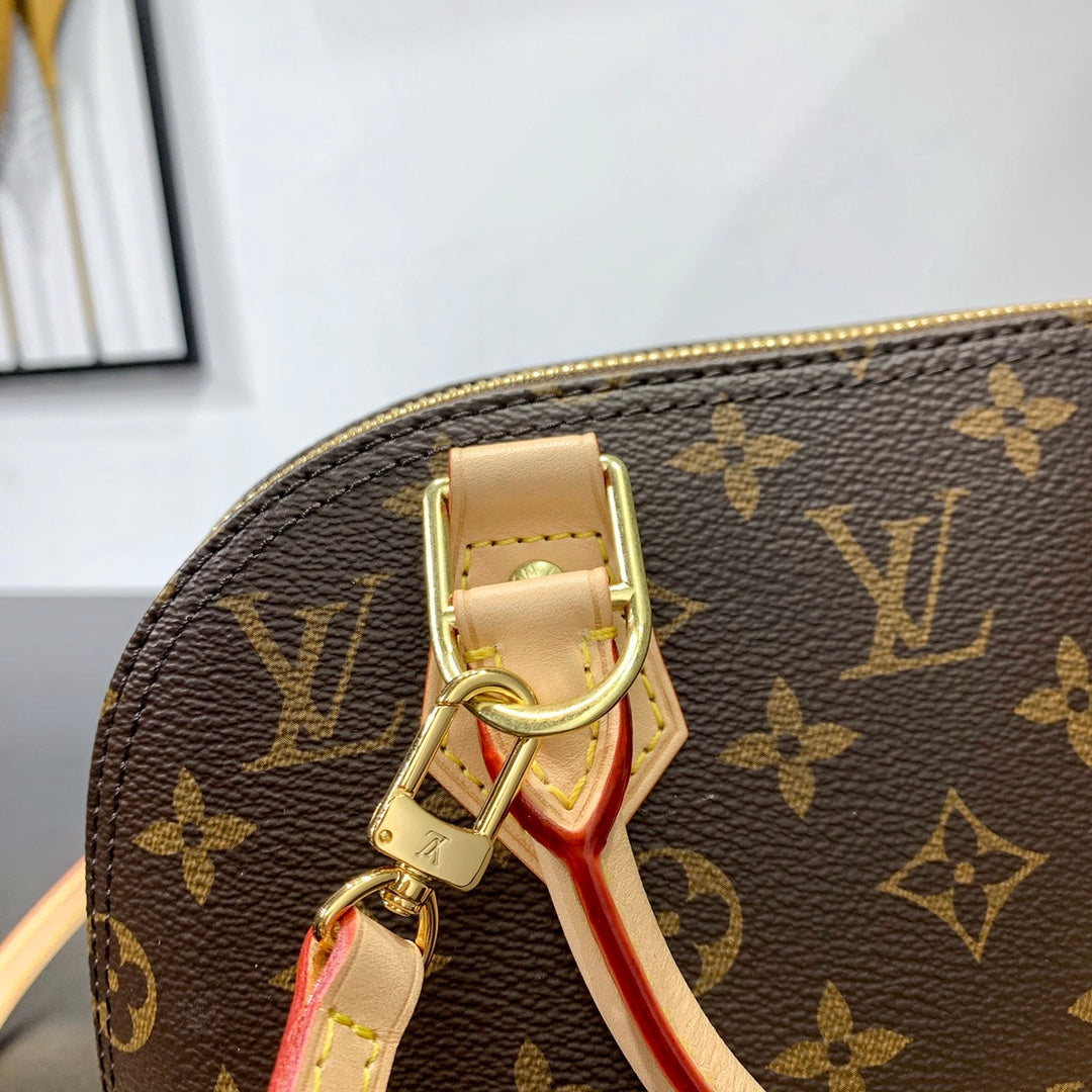 ALMA BB 23 IN BRAUNEM MONOGRAMM-CANVAS UND BEIGEM KALBSLEDERBESATZ MIT GOLDENER SCHNALLE