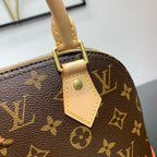 ALMA BB 23 IN BRAUNEM MONOGRAMM-CANVAS UND BEIGEM KALBSLEDERBESATZ MIT GOLDENER SCHNALLE