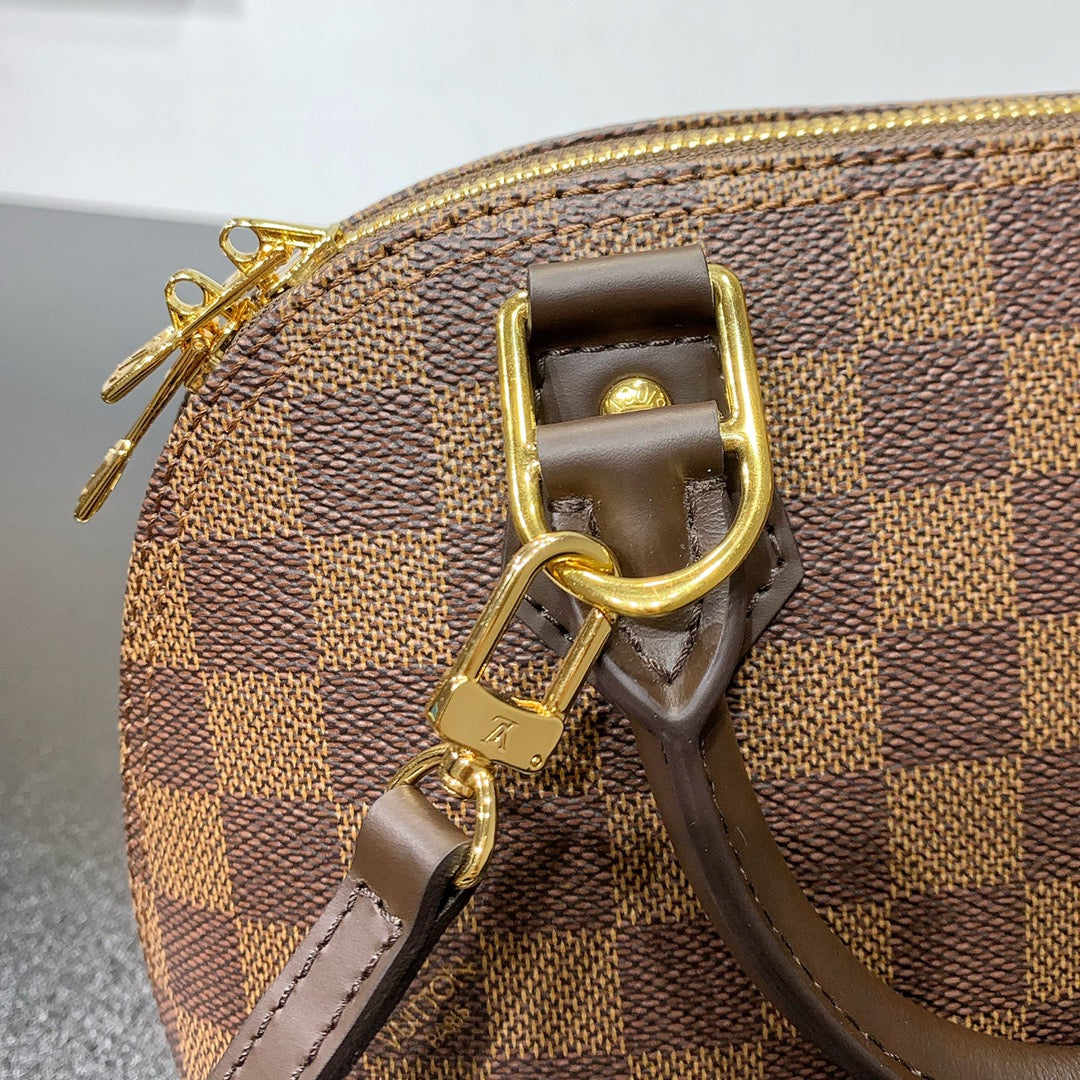 GEFLOCHTENE ALMA BB 23 IN BRAUNER DAMIER EBENE CANVAS-GOLDSCHNALLE