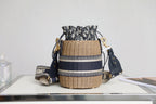 BUCKET BAG 19 IN BLACK OBLIQUE JACQUARD AND BEIGE WICKER