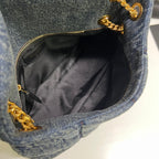 Daunentasche 29 in Blau-Verlauf-Denim mit goldenen Beschlägen