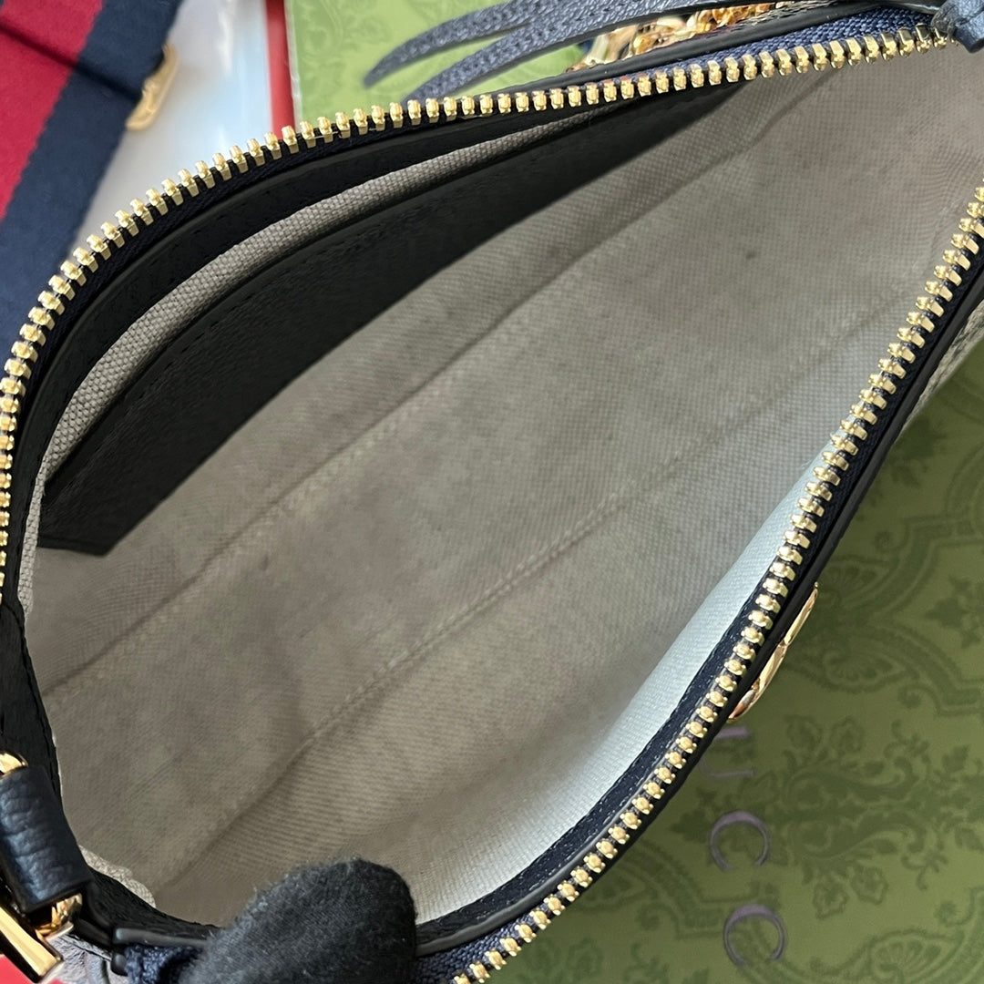 OPHIDIA KLEINE SCHULTERTASCHE 25 IN BEIGEM CANVAS UND SCHWARZEM LAMMLEDER GOLDENE BESCHLÄGE