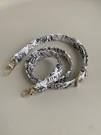 D-JOY 26-TASCHE MITTELGROSSE IN SCHWARZ-WEISSEM KALBSLEDER