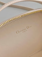 SIGNATURE 18 OVAL TASCHE IN BEIGEM KALBSLEDER