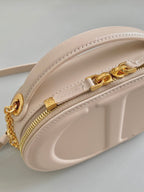 SIGNATURE 18 OVAL TASCHE IN BEIGEM KALBSLEDER