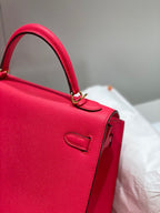 KELLY 25CM IN ROSE TYRIEN SWIFT CALFSKIN GOLD HARDWARE