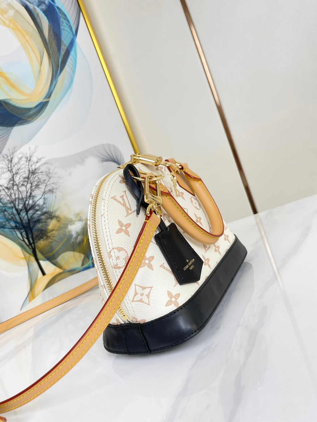 ALMA BB 25 IN WEISS MONOGRAMM DUNE LEINWAND GOLDENE HARDWARE