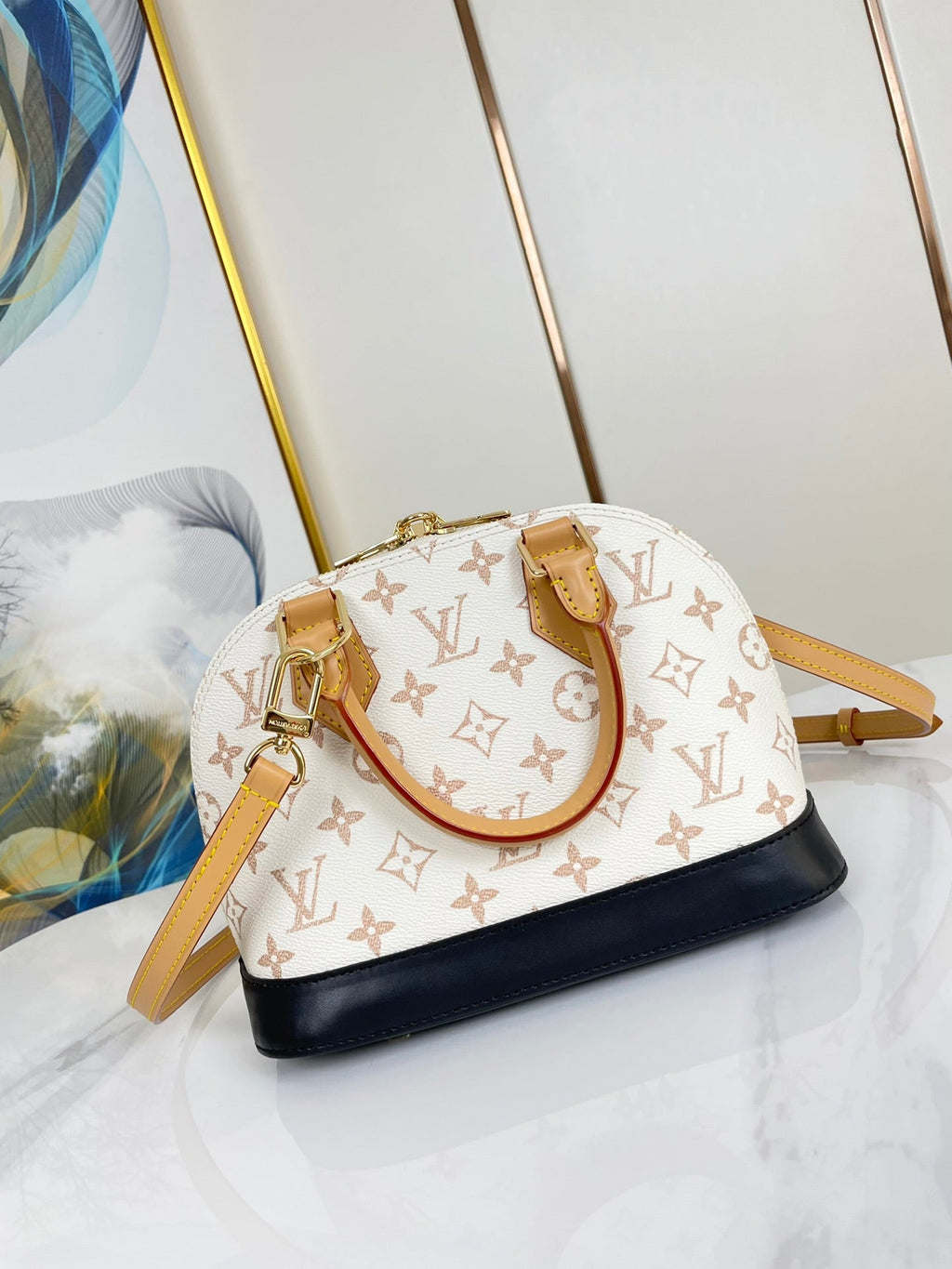 ALMA BB 25 IN WEISS MONOGRAMM DUNE LEINWAND GOLDENE HARDWARE