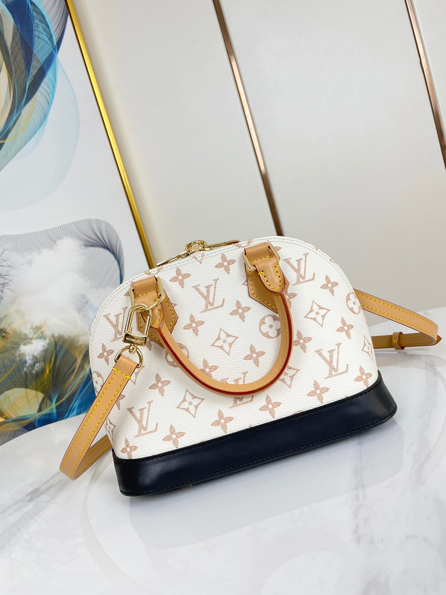 ALMA BB 25 IN WEISS MONOGRAMM DUNE LEINWAND GOLDENE HARDWARE