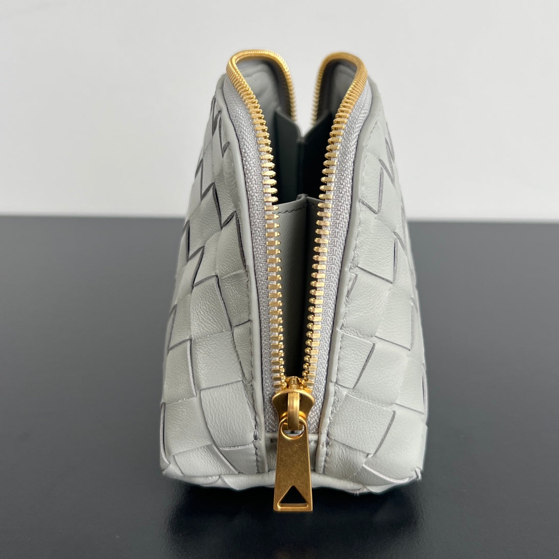 INTRECCIATO 16 TASCHE AUS WEISSEM LAMMFELL