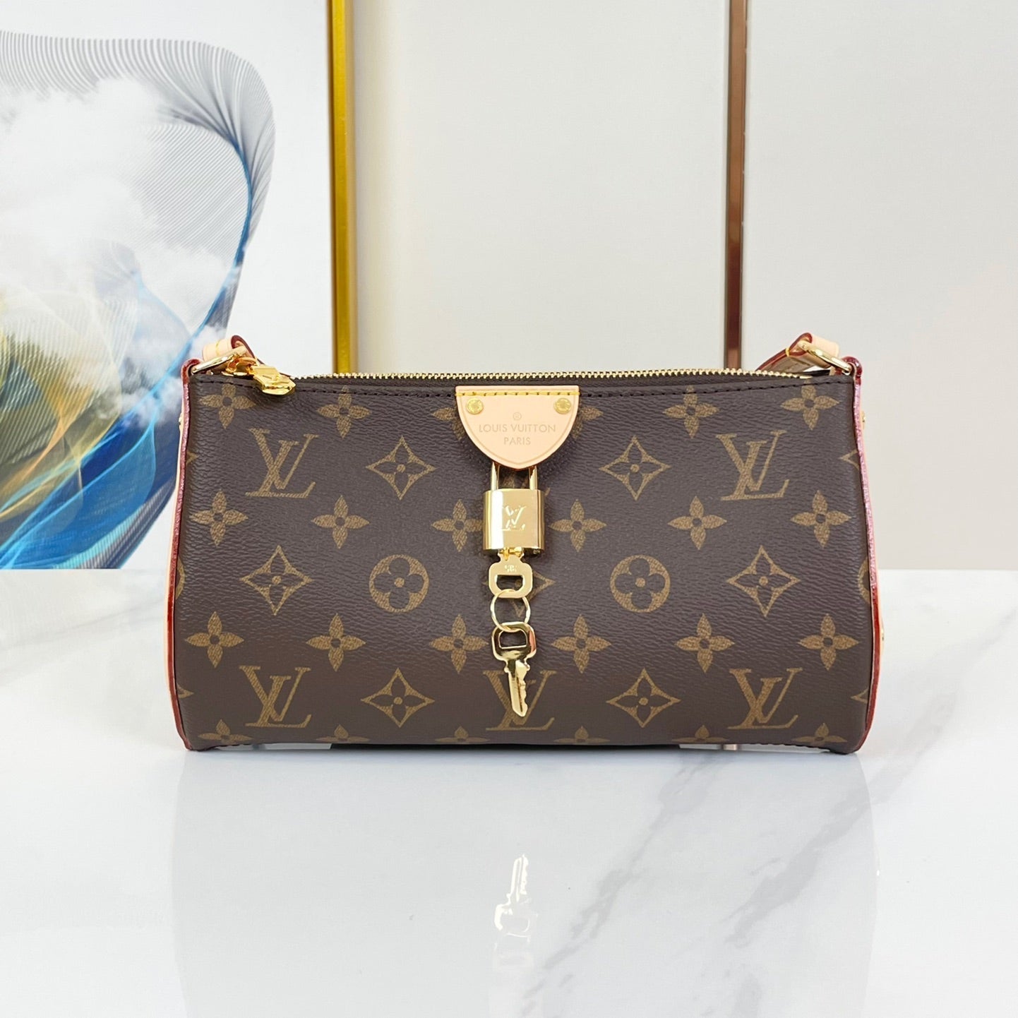 POCHETTE TIRETTE 22 IN BRAUN MONOGRAM CANVAS GOLDENE SCHNALLE