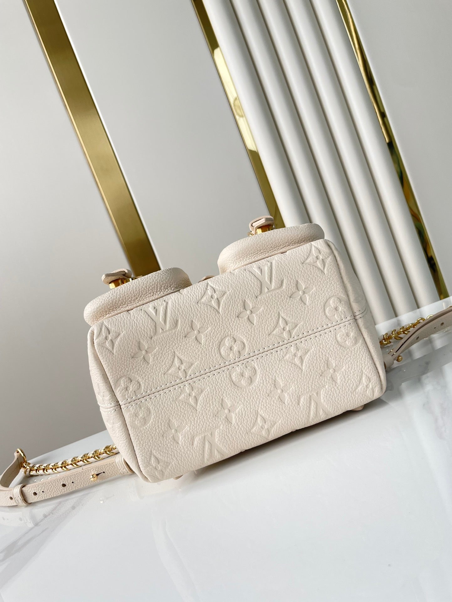 BACKUP-RUCKSACK 22 ZOLL CREME MONOGRAMM EMPREINTE LEDER