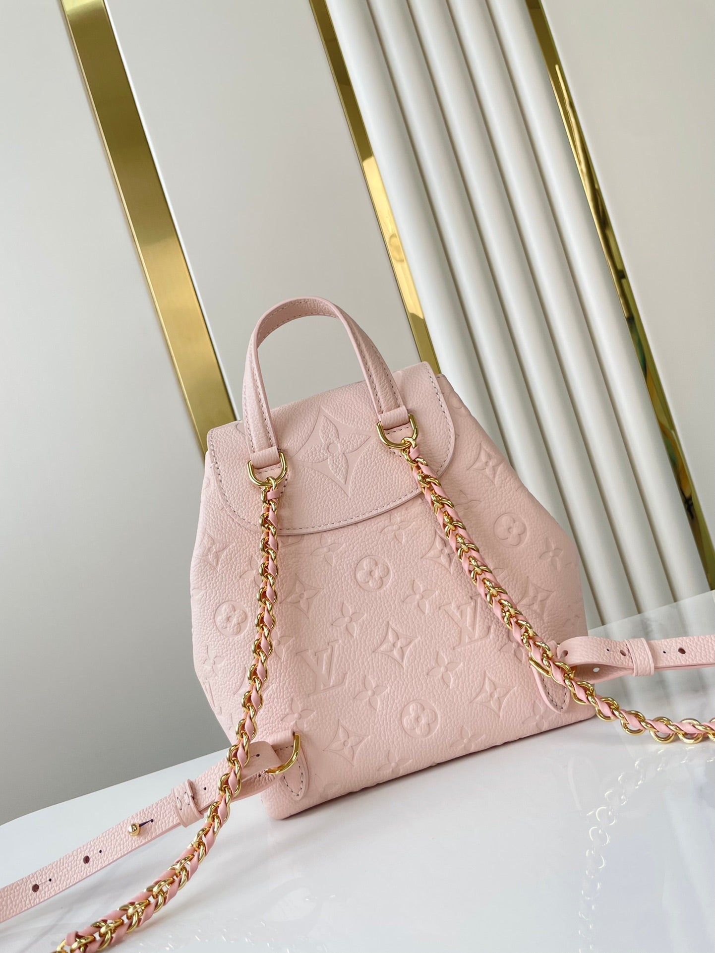 Backup-Rucksack 22 in hellrosa Monogram Empreinte Leder