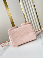 Backup-Rucksack 22 in hellrosa Monogram Empreinte Leder