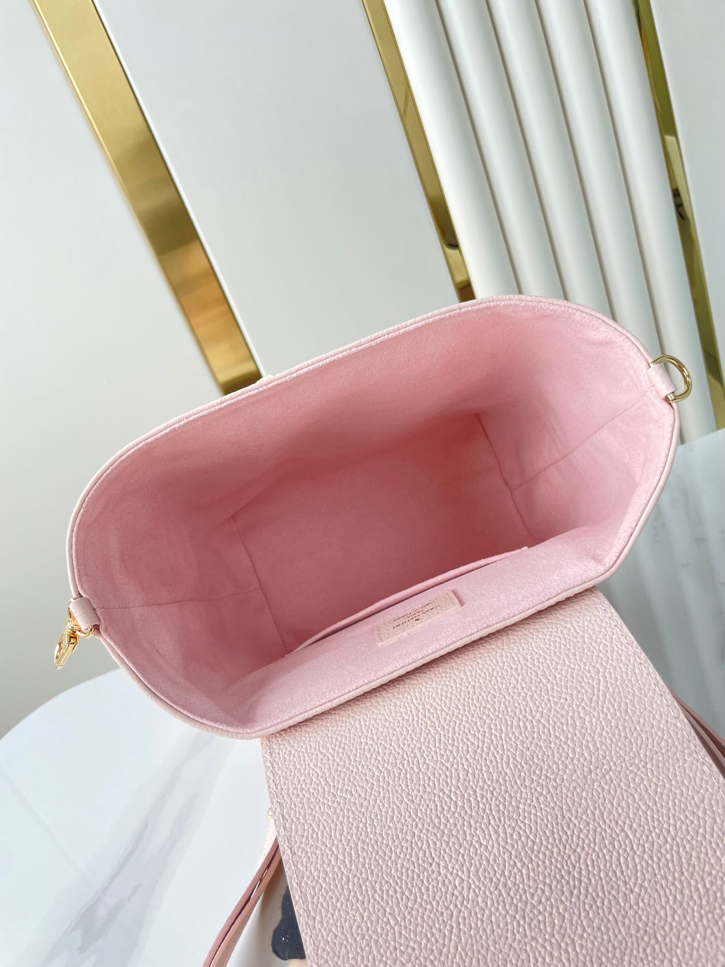 Backup-Rucksack 22 in hellrosa Monogram Empreinte Leder