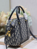 Mittlere 31 D-Vibe Bowlingtasche in blauem Monogram Obliqué Jacquard