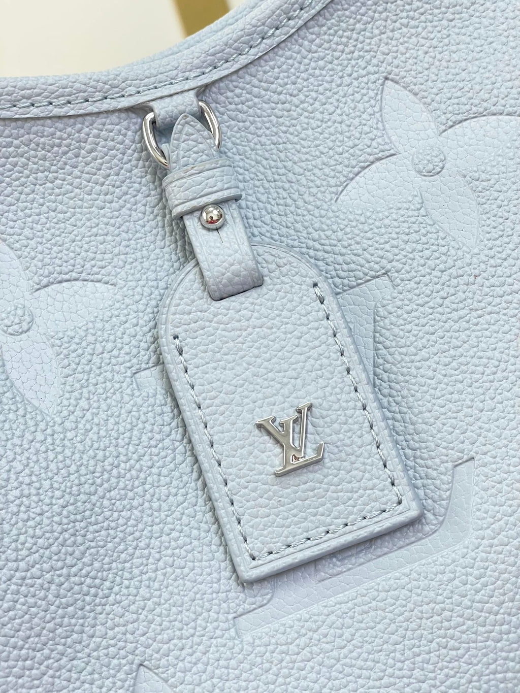 CARRYALL PM 29 IN BEAU BLUE MONOGRAM EMPREINTE LEATHER