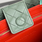 EAST WEST ANDIAMO TASCHE 29 IN ORANGE UND HELLGRÜNEM KALBSLEDER