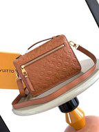 POCHETTE MÉTIS 25 IN COGNAC MONOGRAM EMPREINTE LEATHER GOLD HARDWARE