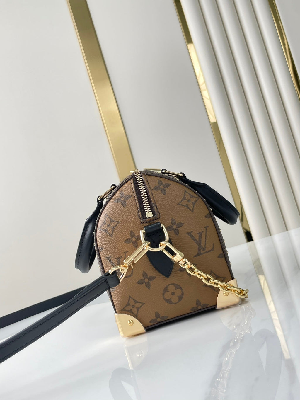 SPEEDY TRUNK 20 IN BRAUNEM MONOGRAMM-CANVAS UND SCHWARZEM KALBSLEDERBESATZ GOLDENE SCHNALLE