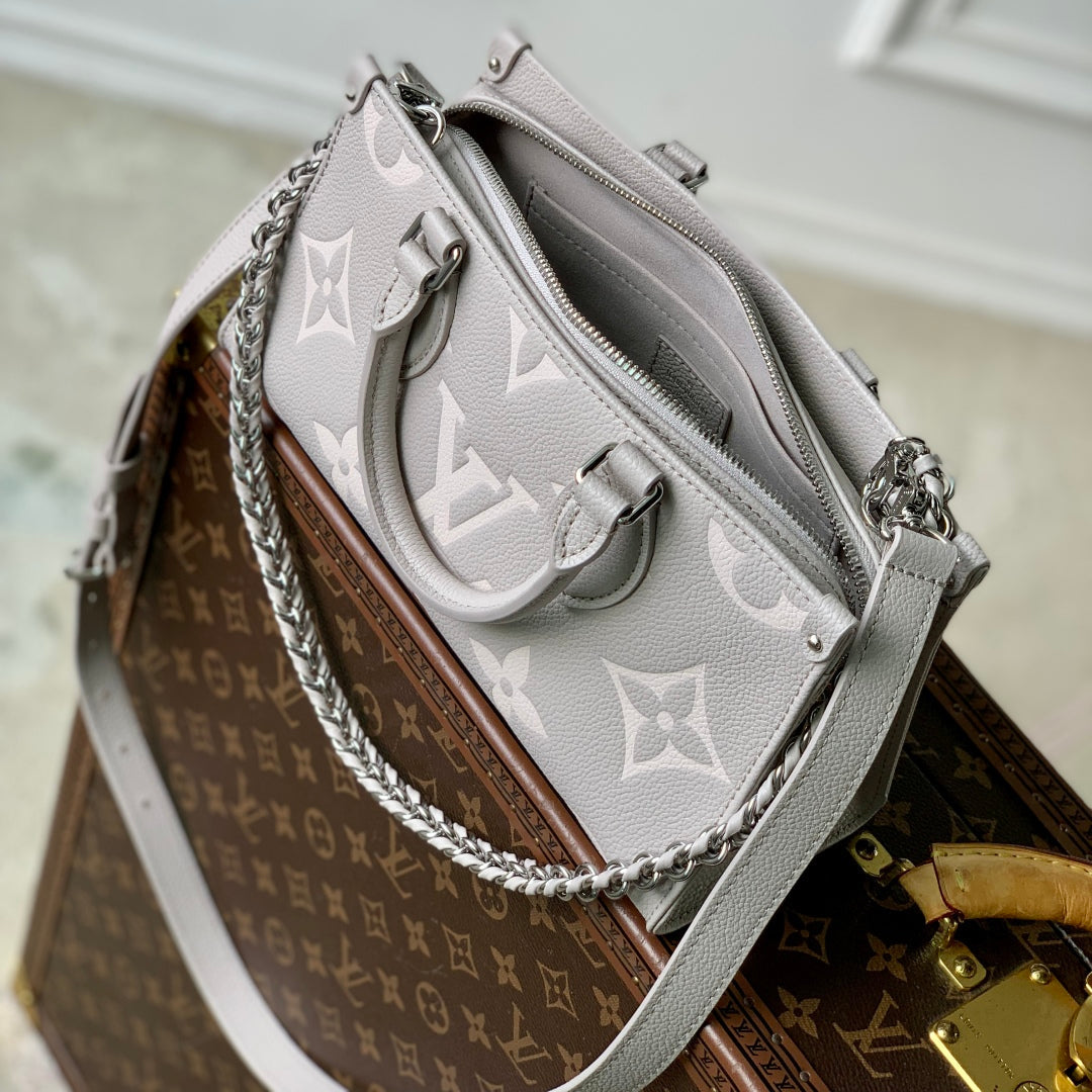 ONTHEGO EAST WEST TASCHE 25 IN BICOLOR MONOGRAM EMPREINTE LEDER