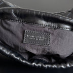 KLEINER STAUBBEUTEL 21 IN SCHWARZEM LAMMLEDER