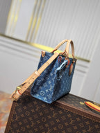 LV 25S ONTHEGO 28 IN BLUE MONOGRAM DENIM COTTON CALFSKIN LEATHER STRAP
