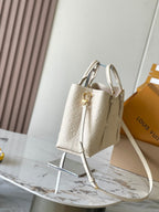 BABYLONE-TASCHE 31 AUS WEISSEM MONOGRAM-EMPREINTE-LEDER