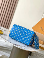 SPEEDY P9 BANDOULIÈRE 25 IN BLAUEM MONOGRAMM-LEINWAND GOLDENE BESCHLÄGE