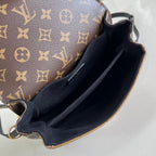 POCHETTE MÉTIS 20 IN BRAUN MONOGRAM UND MONOGRAM REVERSE CANVAS GOLDENE SCHNALLE