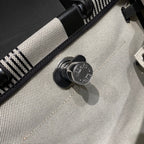 HERBAG A DOS ZIP RETOURNE BACKPACK 29 IN OFF-WHITE MIX BLACK CANVAS AND CALFSKIN