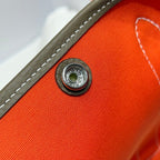 GARDEN PARTY 30CM IN ORANGE MINIMUM TOILETS COTTON CANVAS AND BROWN CALFSKIN