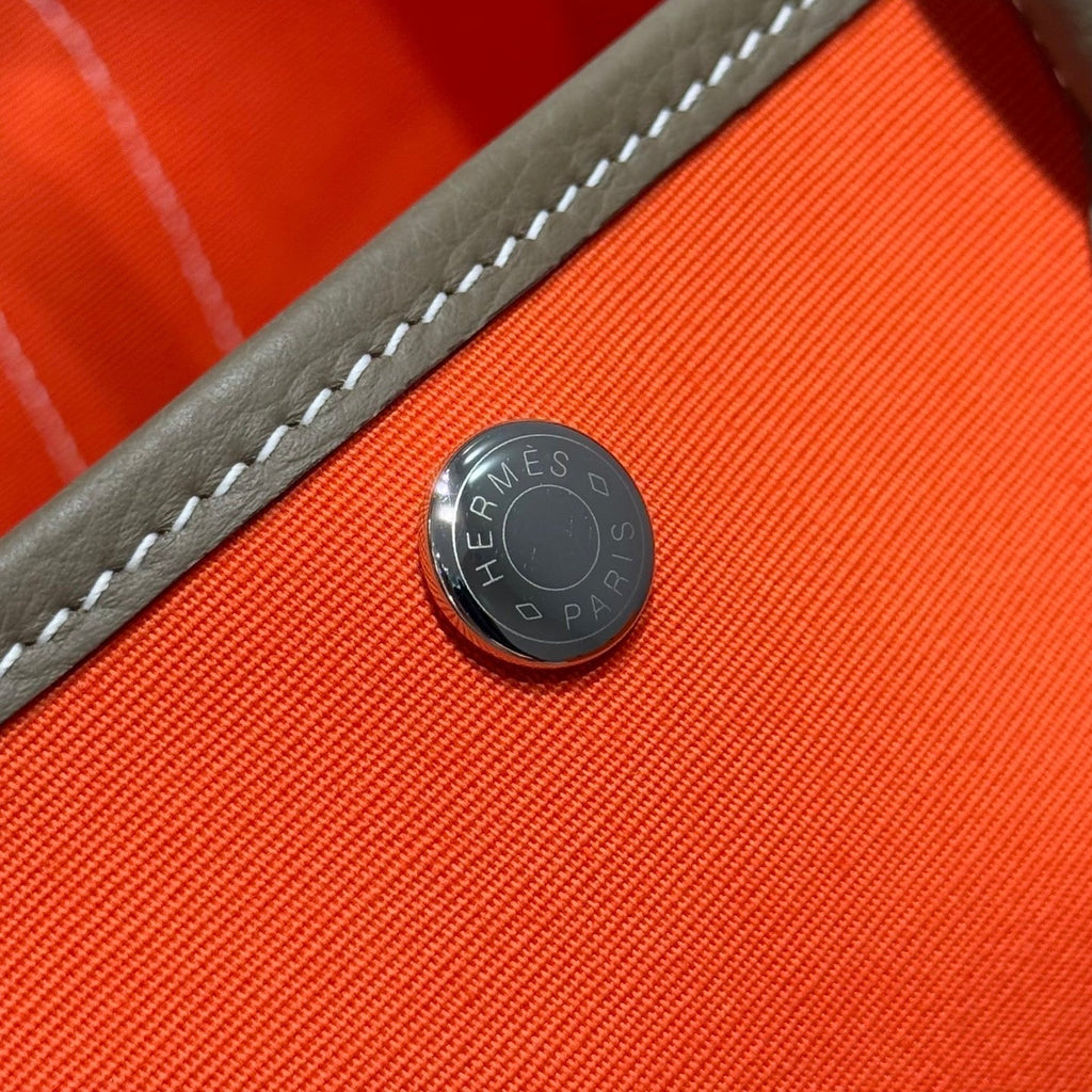 GARDEN PARTY 30CM IN ORANGE MINIMUM TOILETS COTTON CANVAS AND BROWN CALFSKIN