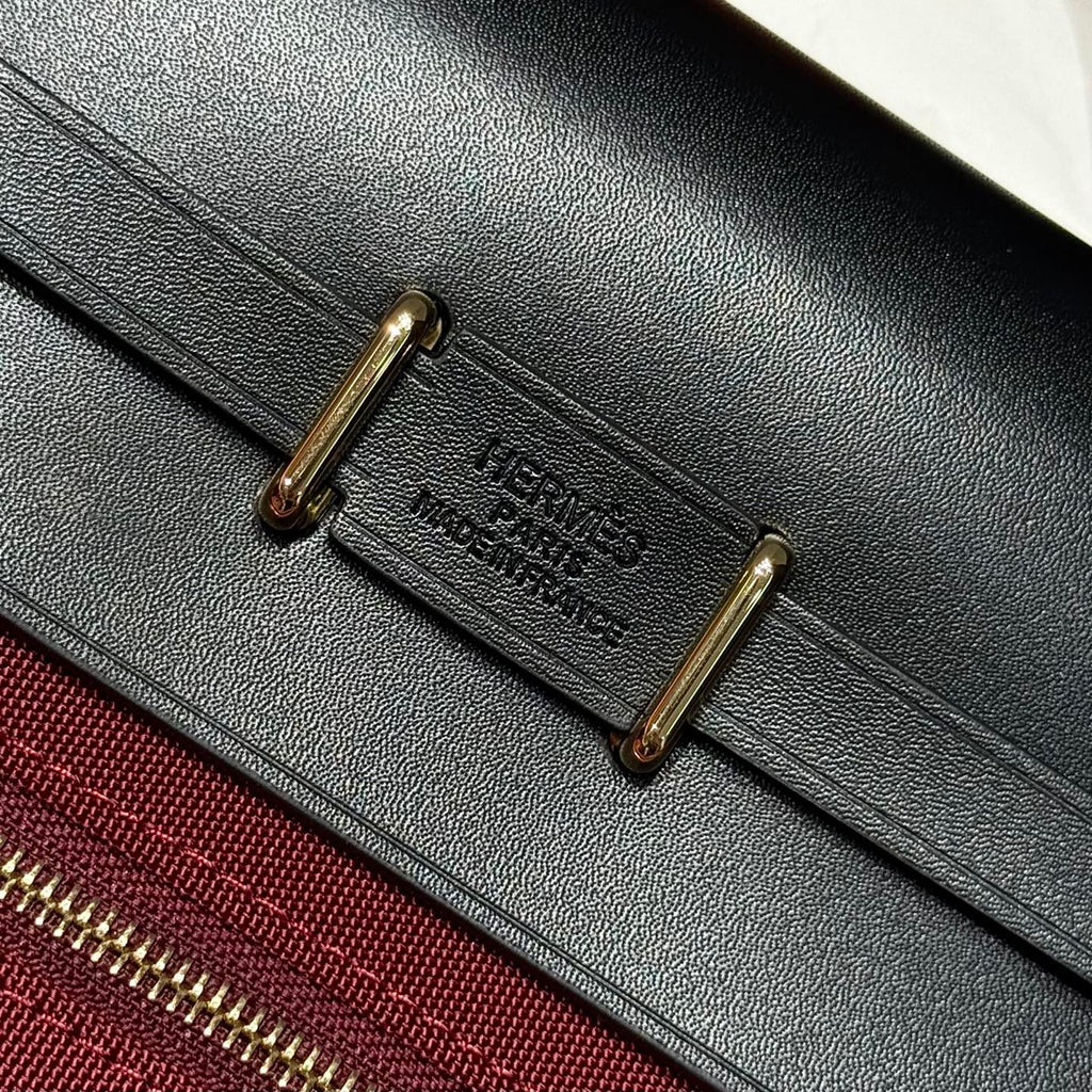 HERMES 25S MINI HERBAG 20 IN RED AND BLACK CANVAS GOLD HARDWARE