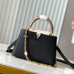 CAPUCINES BB 27 IN SCHWARZ MIX WEISS TAURILLON GOLD HARDWARE