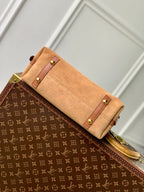 CARRYALL PM 29 IN CIDER BROWN MONOGRAM PERFORATED SUEDE AND WHITE SHEARLING TRIM