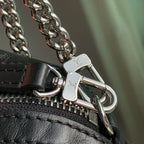 POCHETTE VIBE HANDBAG 25 IN BLACK LAMBSKIN BROWN COWHIDE AND COATED CANVAS TRIM