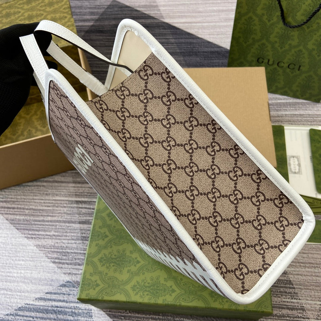 Tragetasche mit Tiermuster, 28 Zoll, aus beigefarbenem Canvas mit weißem Kalbslederbesatz