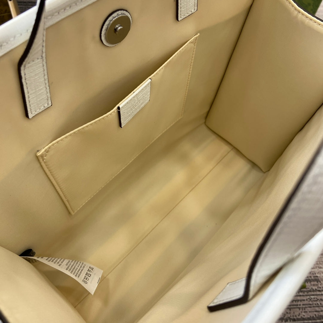 Tragetasche mit Tiermuster, 28 Zoll, aus beigefarbenem Canvas mit weißem Kalbslederbesatz