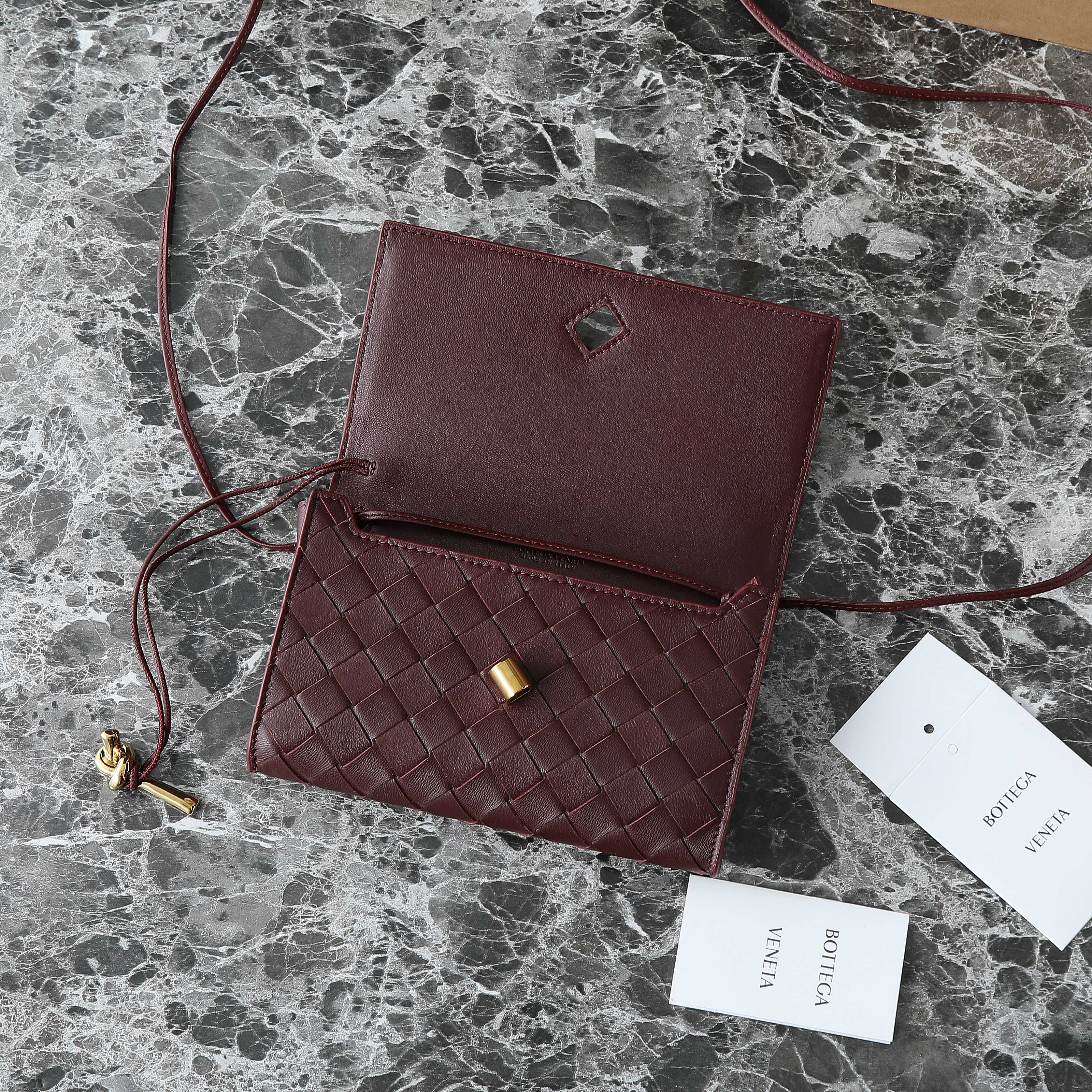 BOTTEGA VENETA 25S ANDIAMO POUCH 19 IN DEEP MAROON KALBSKIN GOLD HARDWARE