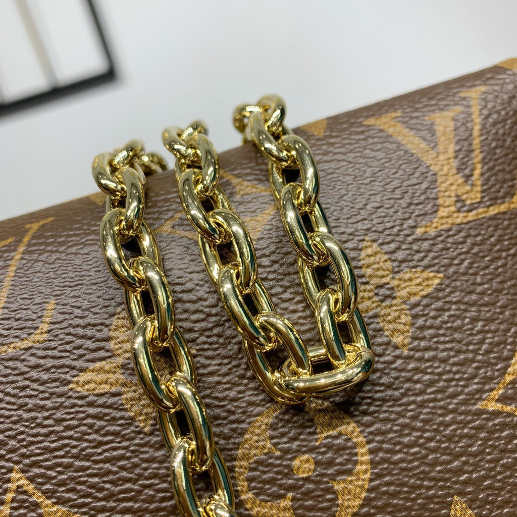 BLOOM POUCH 22 AUS BRAUNEM MONOGRAMM-CANVAS UND SEITEN AUS PASTELROSEM KALBSLEDER