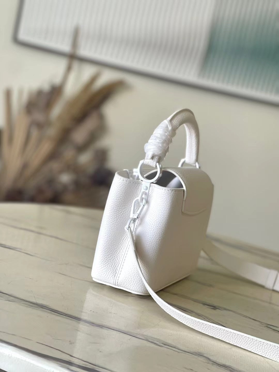 CAPUCINES EAST-WEST MINI 21 IN WEISSEM TAURILLON